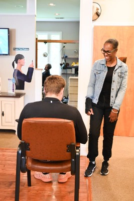 Ciera Chatting With Patient At Combs Chiropractic & Wellness