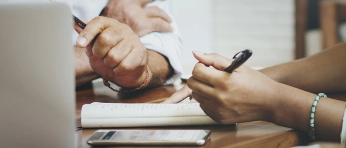 Wellness Partners Hands Signing A Paper