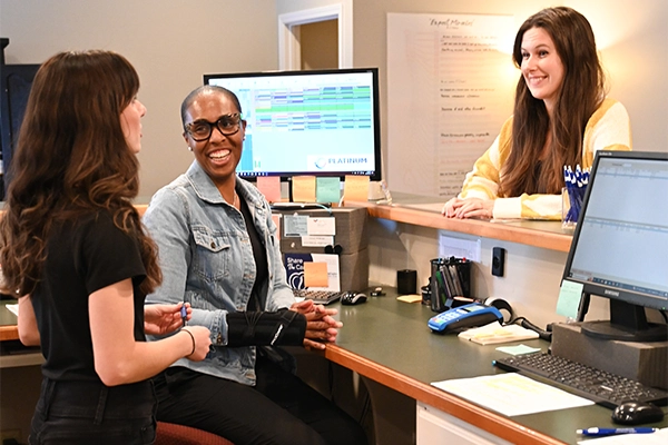 Team Members Checking Patient In At Combs Chiropractic & Wellness