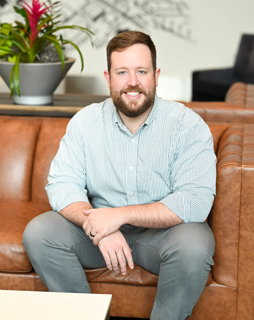 Chiropractor Alex Combs Seated Welcoming You