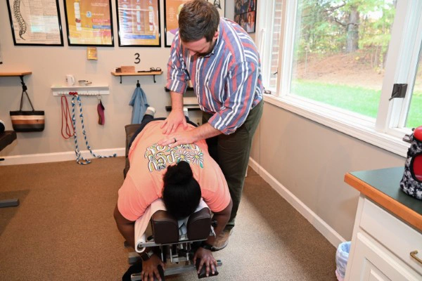 Chiropractor Alex Combs Adjusting Patients Back