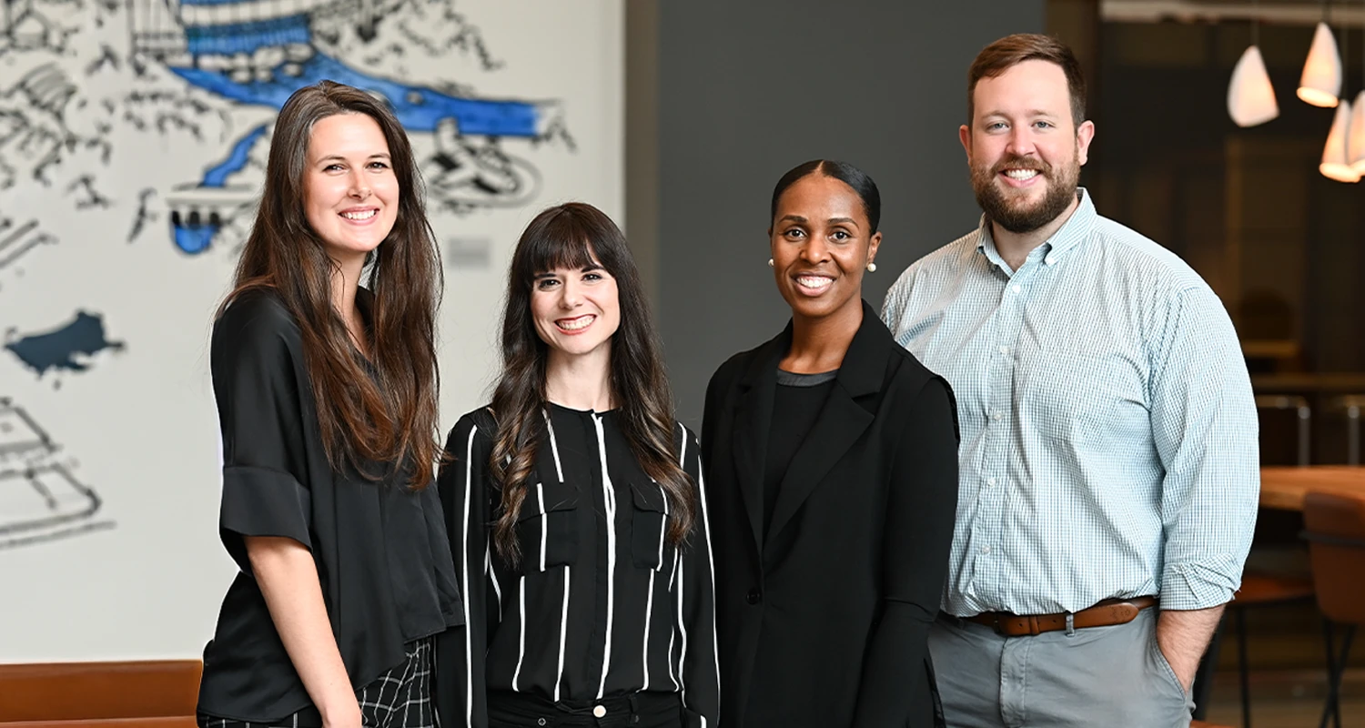 Chiropractor Alex Combs With Support Team