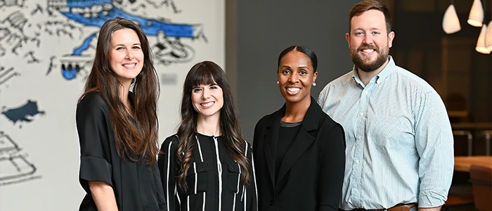 Chiropractor Alex Combs With Support Team